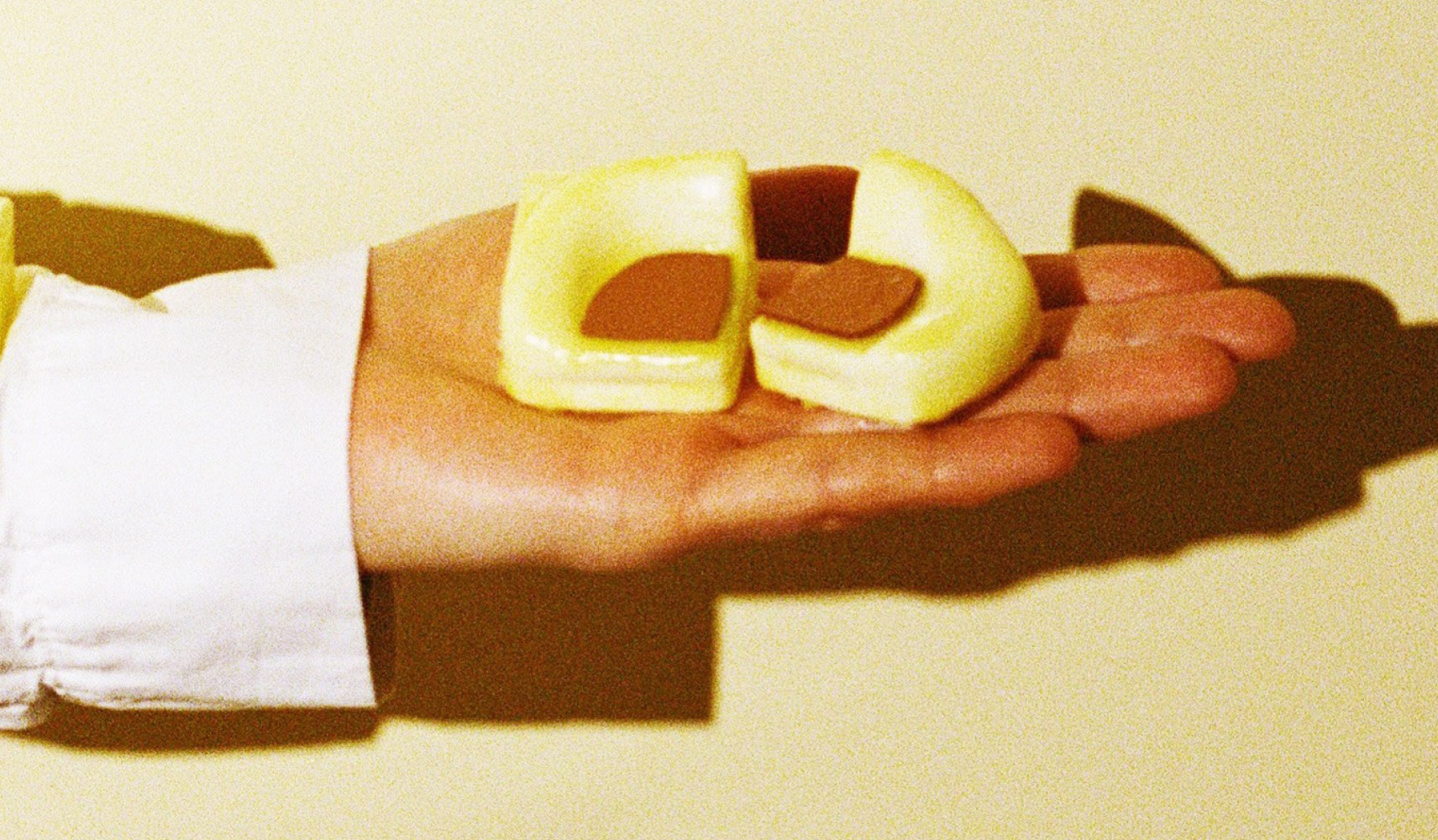 Milan Design Week 2025 Faye Toogood and Tacchini promotional image of a hand holding a small sculpture.